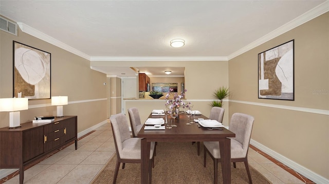 tiled dining space with ornamental molding