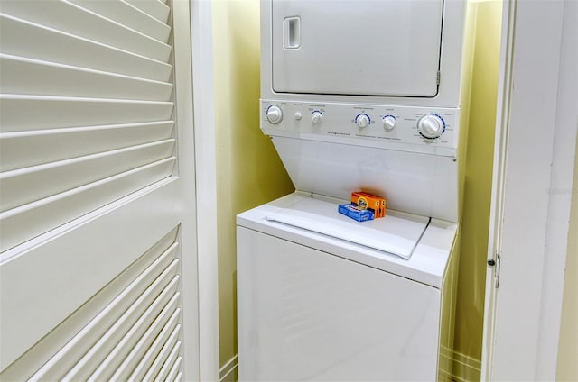 915 Seaside Drive 312, Weeks 16-17, Sarasota, FL 34242 - laundry area with estacked washer and dryer