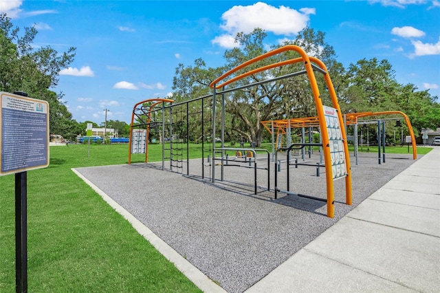 view of property's community featuring a playground and a lawn