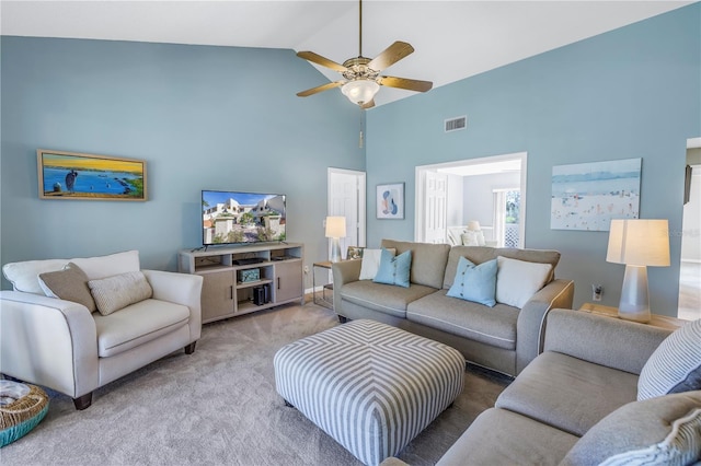 carpeted living room featuring ceiling fan and lofted ceiling