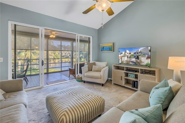 carpeted living room featuring ceiling fan and high vaulted ceiling