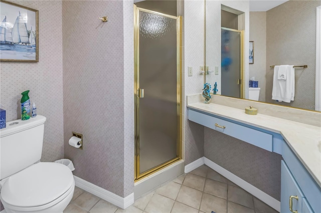 bathroom featuring tile patterned floors, vanity, an enclosed shower, and toilet