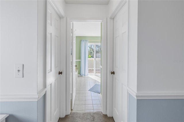 corridor featuring light carpet