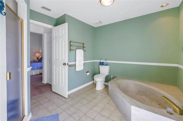 bathroom featuring toilet, separate shower and tub, and tile patterned floors