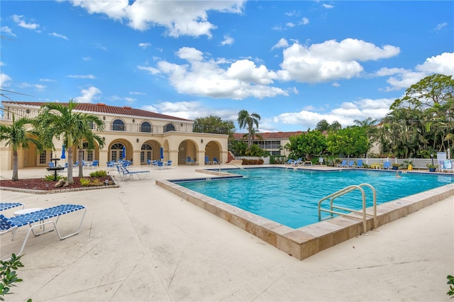 view of pool featuring a patio