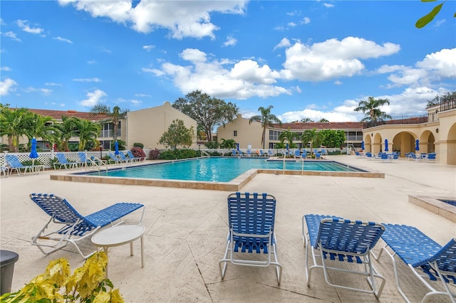 view of swimming pool featuring a patio