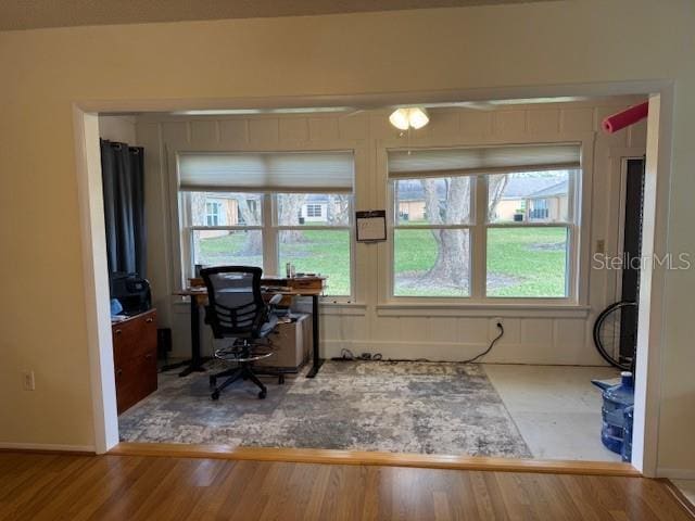 office space with a healthy amount of sunlight and wood-type flooring