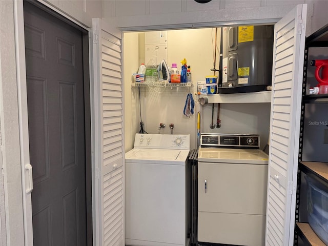 laundry room featuring washer and dryer and water heater