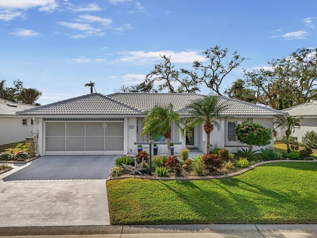 ranch-style house featuring a front yard and a garage