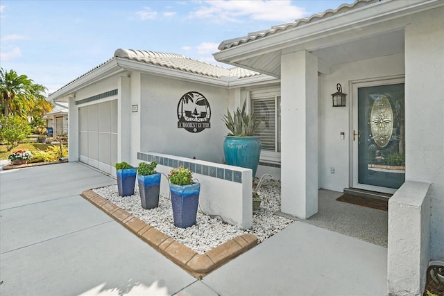 entrance to property featuring a garage