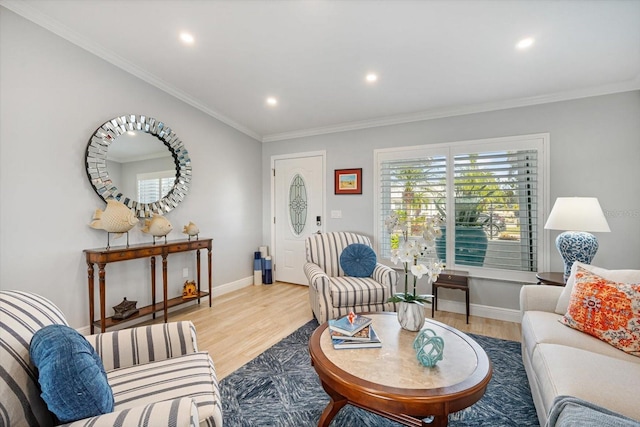 living room featuring ornamental molding and light hardwood / wood-style flooring