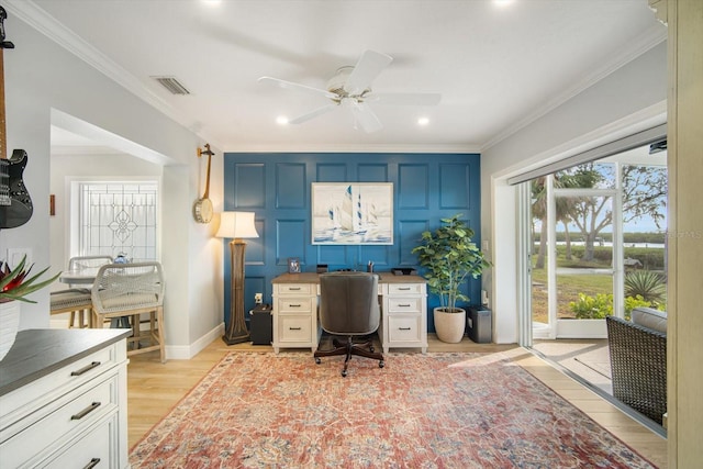 home office featuring ceiling fan, light hardwood / wood-style floors, and ornamental molding