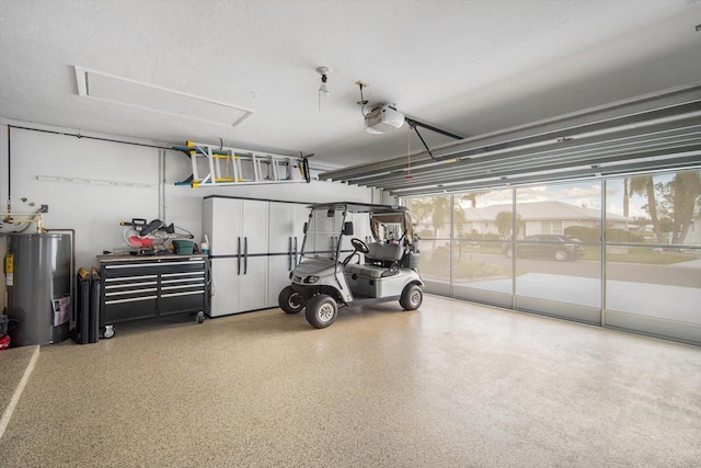 garage featuring a garage door opener and water heater