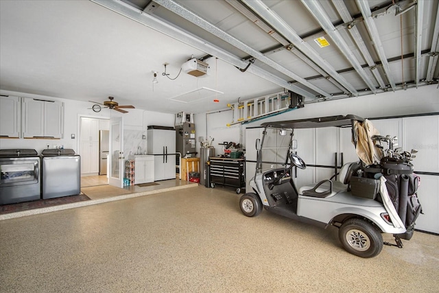 garage featuring ceiling fan, a garage door opener, and independent washer and dryer