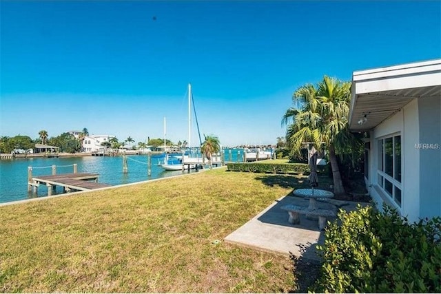 exterior space with a water view and a boat dock