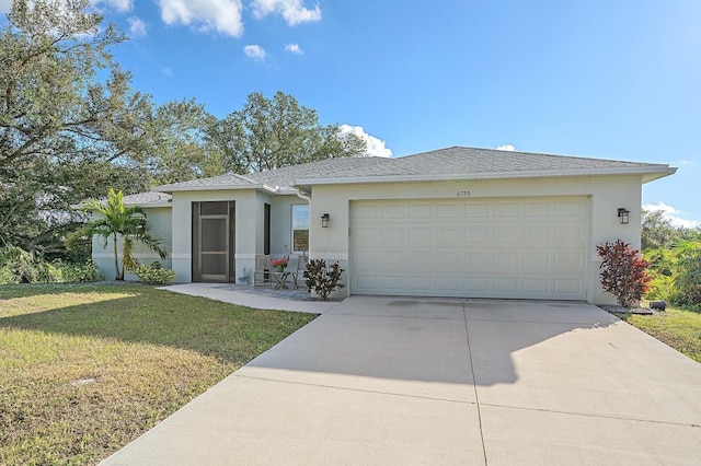 view of front facade featuring a front yard and a garage