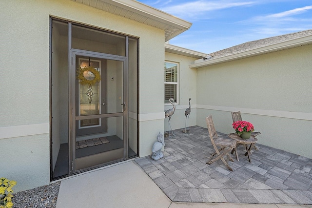 entrance to property with a patio area