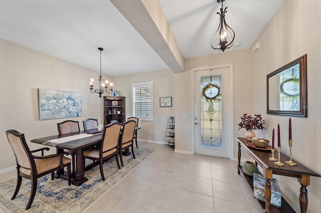 dining area with a notable chandelier and light tile patterned flooring