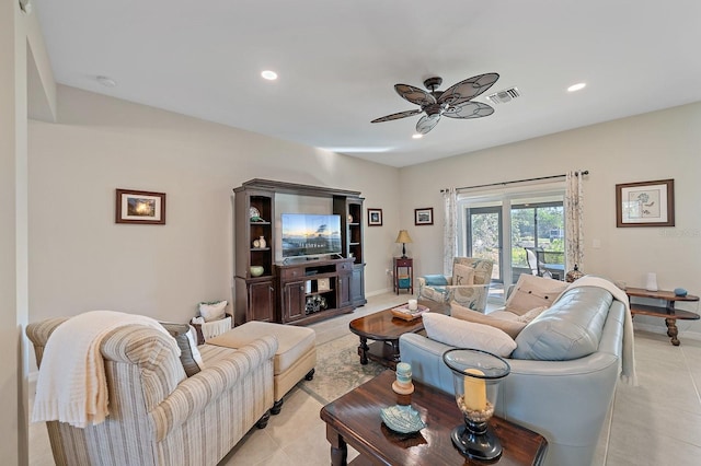 living room featuring light tile patterned floors and ceiling fan