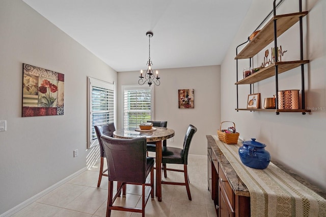 tiled dining space featuring a notable chandelier