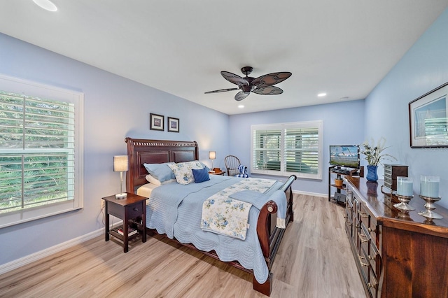 bedroom featuring light hardwood / wood-style floors and ceiling fan