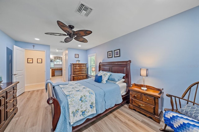 bedroom featuring light hardwood / wood-style flooring and ceiling fan