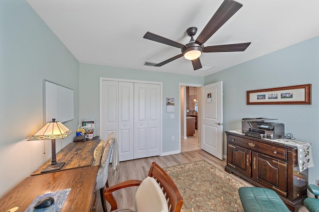 office featuring ceiling fan and light hardwood / wood-style flooring