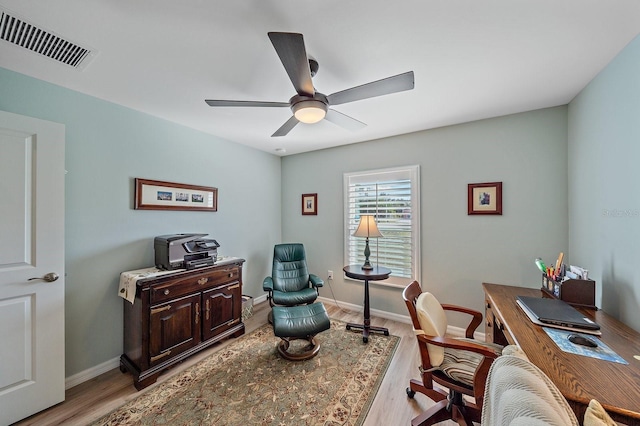 office area featuring light hardwood / wood-style flooring and ceiling fan