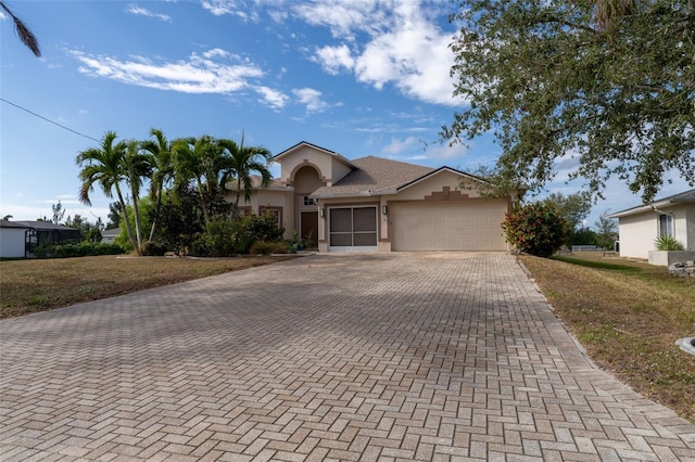 view of front facade featuring a garage and a front lawn