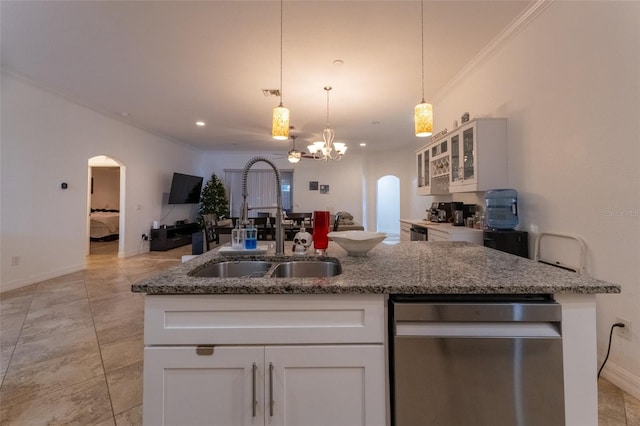 kitchen featuring decorative light fixtures, white cabinetry, sink, and an inviting chandelier