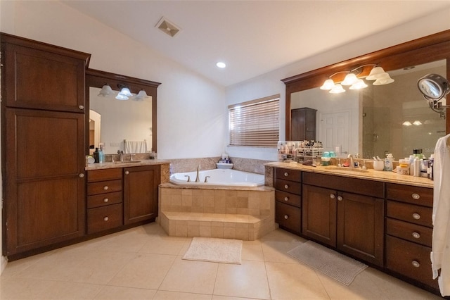 bathroom with tile patterned floors, plus walk in shower, and vanity