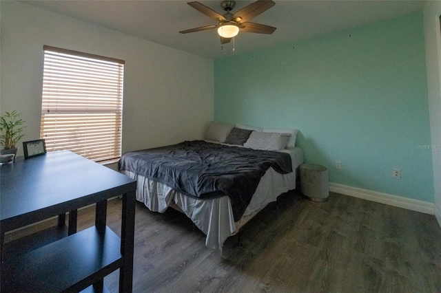 bedroom featuring dark hardwood / wood-style floors and ceiling fan