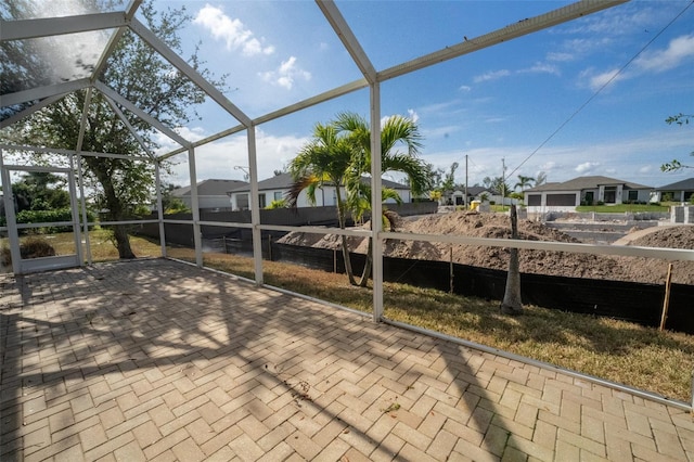 view of patio with a lanai