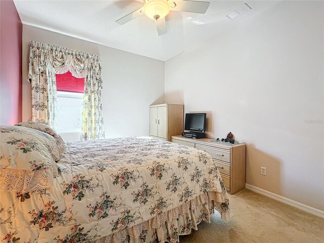 bedroom featuring ceiling fan and light colored carpet