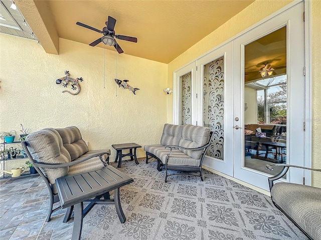 view of patio with french doors and ceiling fan