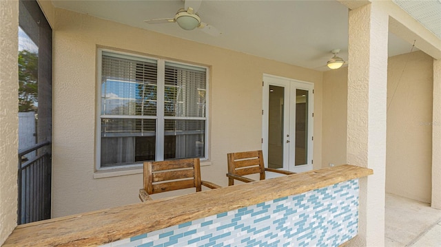 view of patio / terrace featuring a ceiling fan and french doors