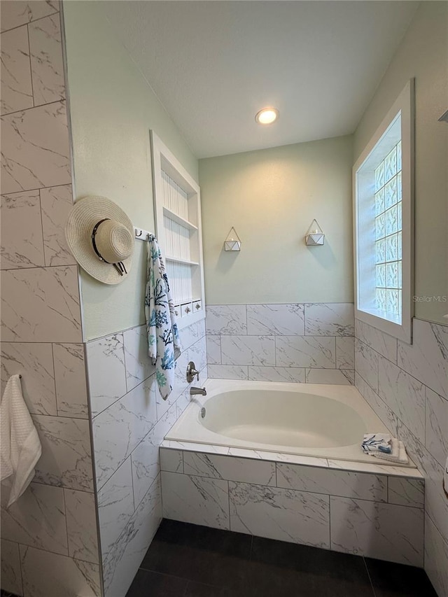 full bathroom with a garden tub, tile walls, and recessed lighting