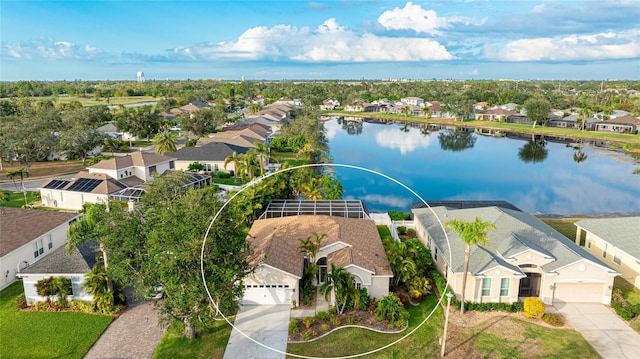 bird's eye view with a water view and a residential view