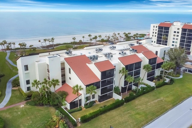 bird's eye view with a beach view and a water view