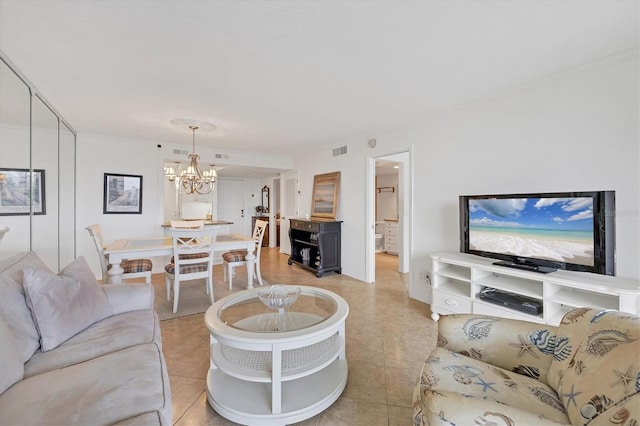 tiled living room with a notable chandelier