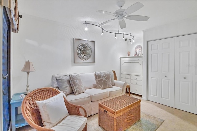 tiled living room featuring ceiling fan