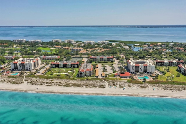 bird's eye view with a water view and a beach view