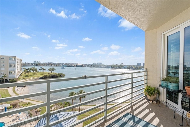 balcony featuring a water view