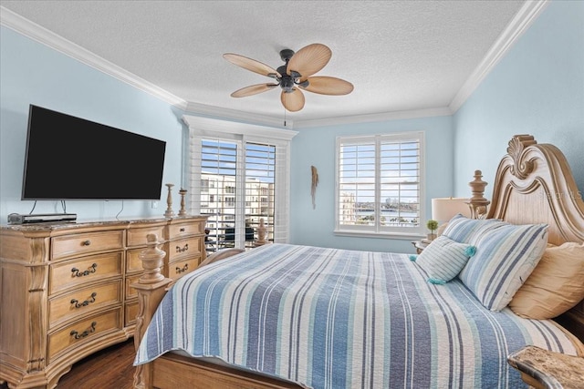 bedroom with ceiling fan, wood-type flooring, ornamental molding, and a textured ceiling