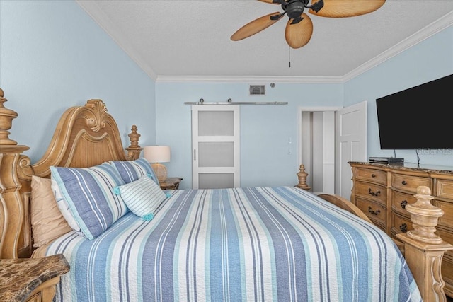 bedroom featuring ceiling fan, ornamental molding, and a textured ceiling