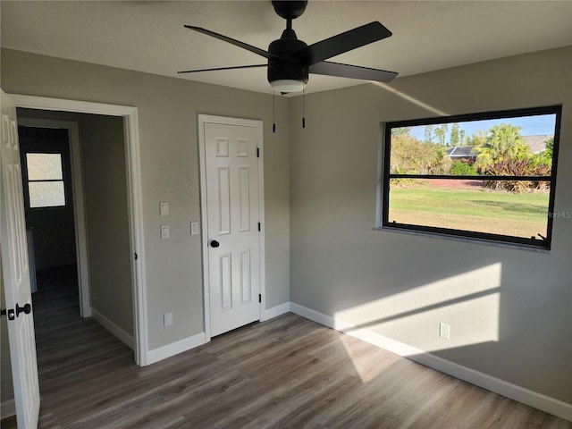 unfurnished bedroom featuring ceiling fan and wood-type flooring