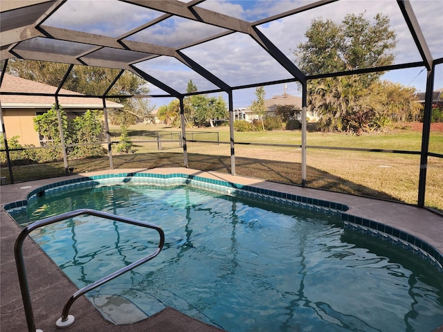 view of swimming pool with a yard and glass enclosure