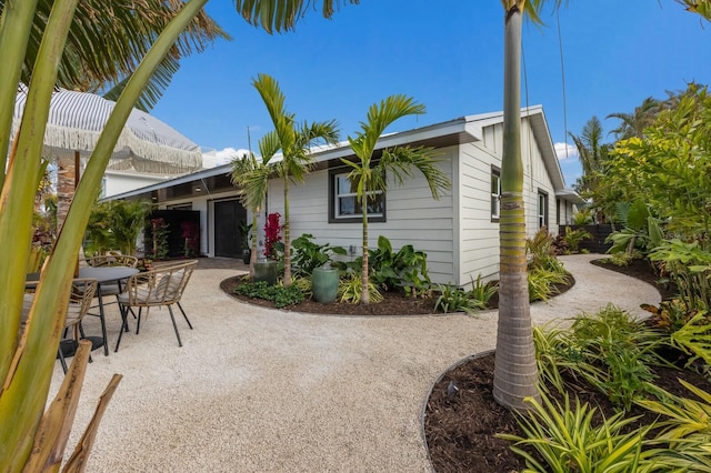 back of property with a patio