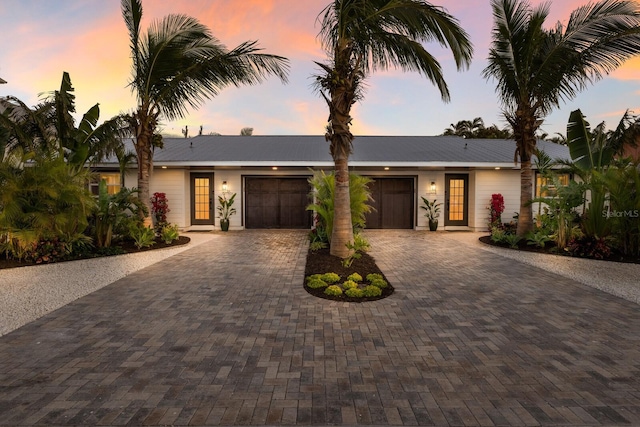 view of front of property with a garage