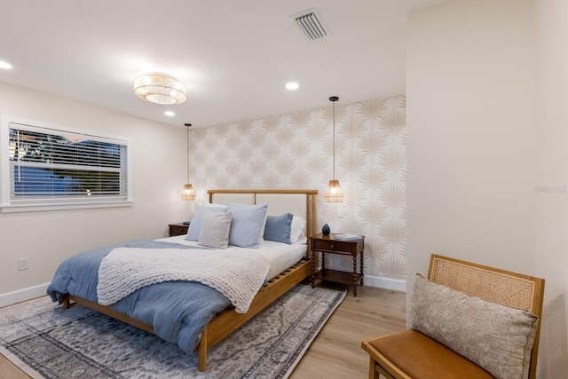 bedroom with light hardwood / wood-style floors